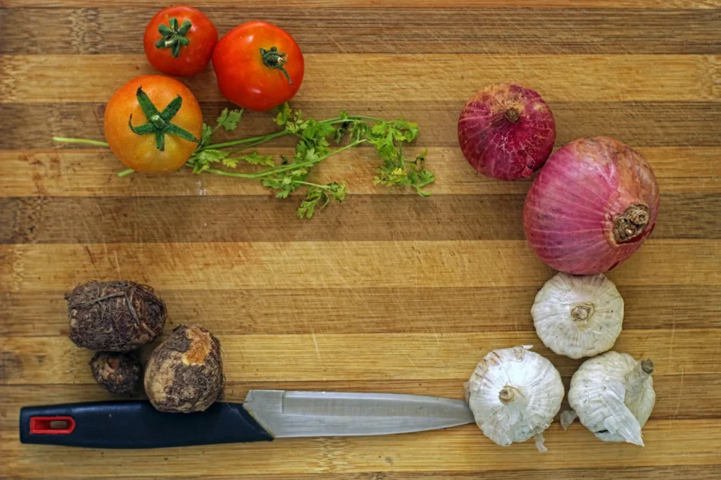 Fresh vegetables and herbs on a chopping board