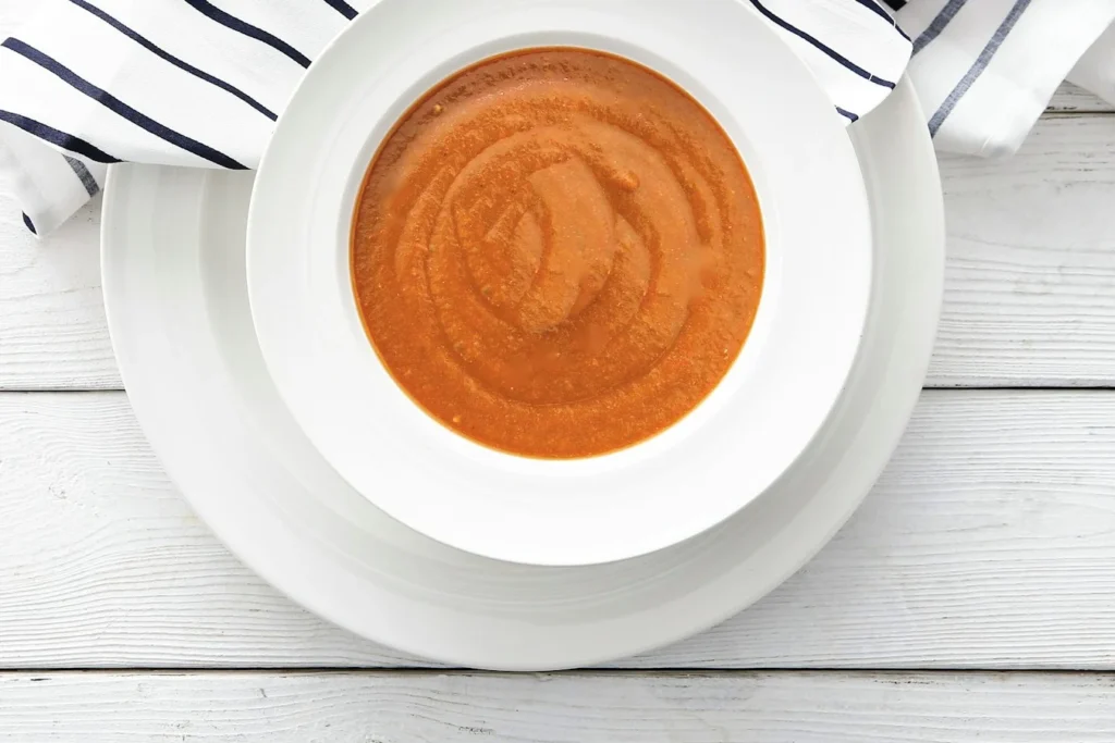 Bowl of smooth, creamy orange bisque-style soup